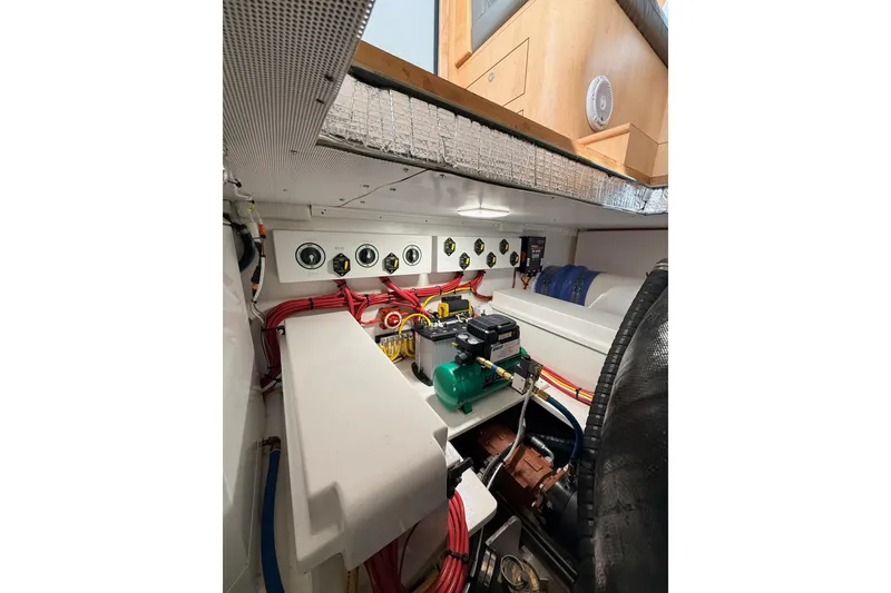 Slide: The Image of Engine room of 2025 Wesmac 42 boat with filtration system and blue hoses. - 55