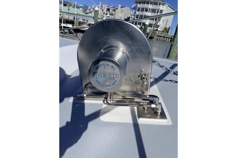 Slide: The Image of 2025 Wesmac 42 boat docked, featuring a sleek deck and modern design. - 9