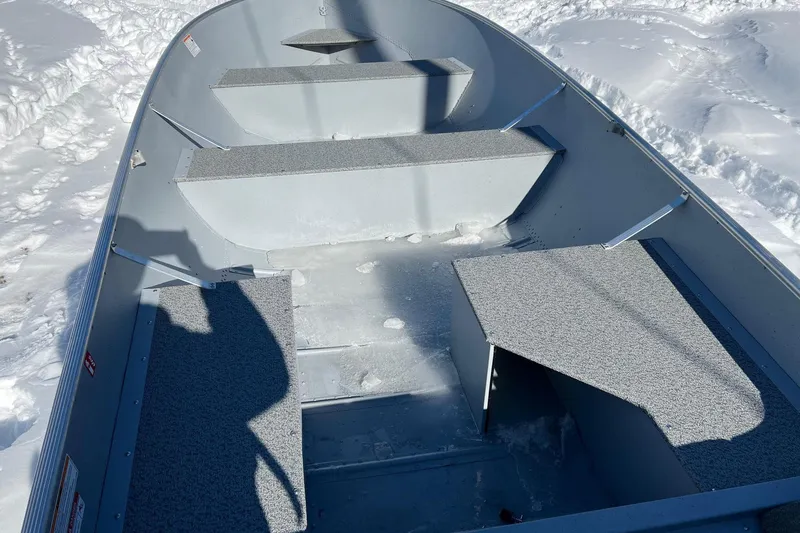 Slide: The Image of Interior of a 2026 Lund WC-16 boat on snow-covered ground. - 7