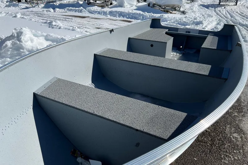 Slide: The Image of 2026 Lund WC-16 boat interior with snow-covered surroundings. - 8