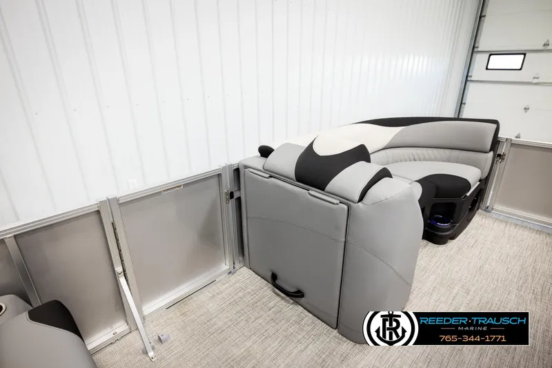 Slide: The Image of 2026 Avalon LSZ QLS pontoon boat interior with gray and black seating in a showroom. - 20