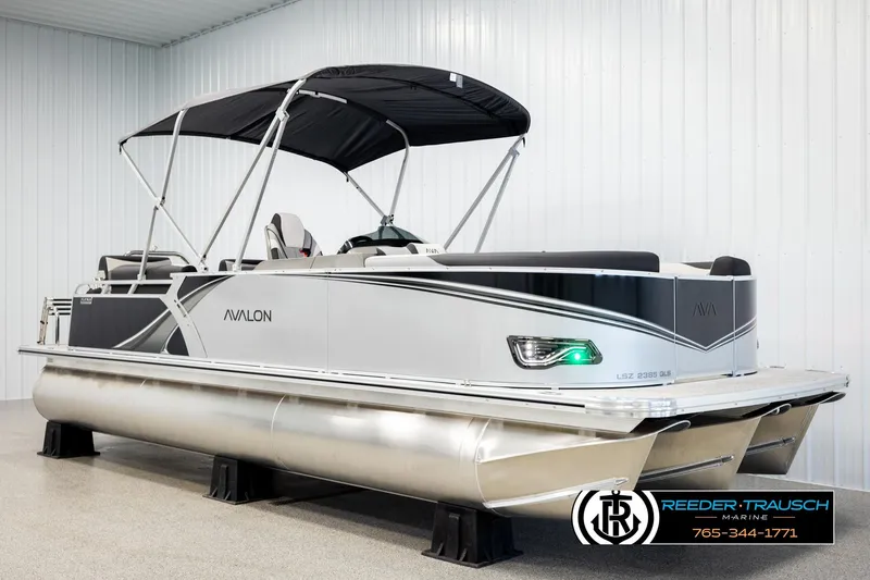 Slide: The Image of 2026 Avalon LSZ QLS pontoon boat with canopy in showroom setting. - 3