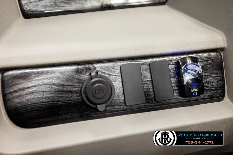 Slide: The Image of Control panel of 2026 Avalon LSZ QLS with mood lighting switch and 12V outlet. - 34