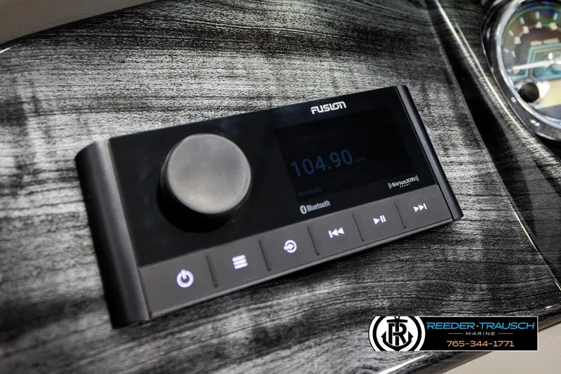 Slide: The Image of 2026 Avalon LSZ QLS boat dashboard with Fusion audio system and Reeder-Trausch Marine branding. - 35