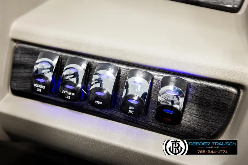 Slide: The Image of Control panel of 2026 Avalon LSZ QLS boat with illuminated switches for various functions. - 39