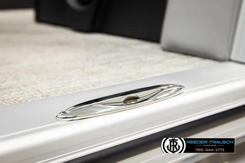 Slide: The Image of Close-up of 2026 Avalon LSZ QLS boat cleat, featuring sleek design and Reeder-Trausch Marine logo. - 53