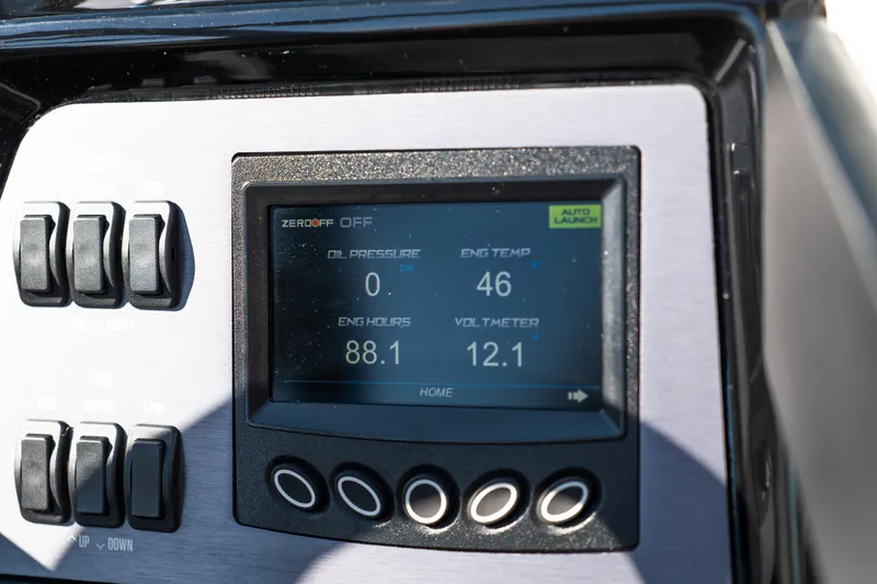 Slide: The Image of Dashboard of 2023 MasterCraft NXT22 showing engine metrics and controls. - 11