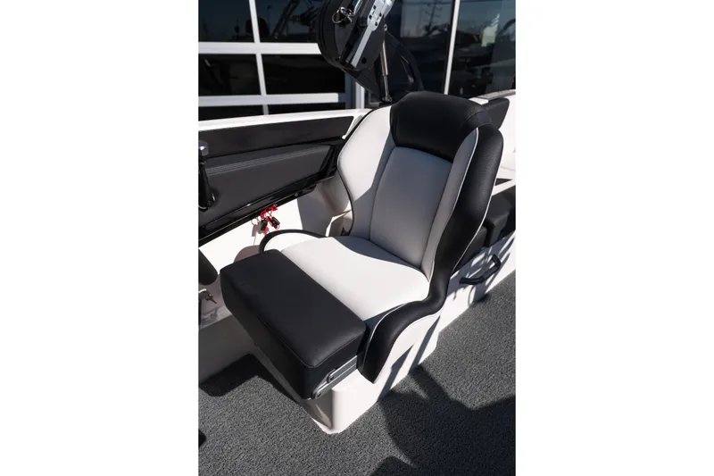 Slide: The Image of 2023 MasterCraft NXT22 boat seat, black and white upholstery, modern design. - 14