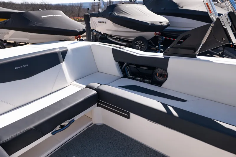 Slide: The Image of 2023 MasterCraft NXT22 boat interior with sleek seating and modern design. - 16