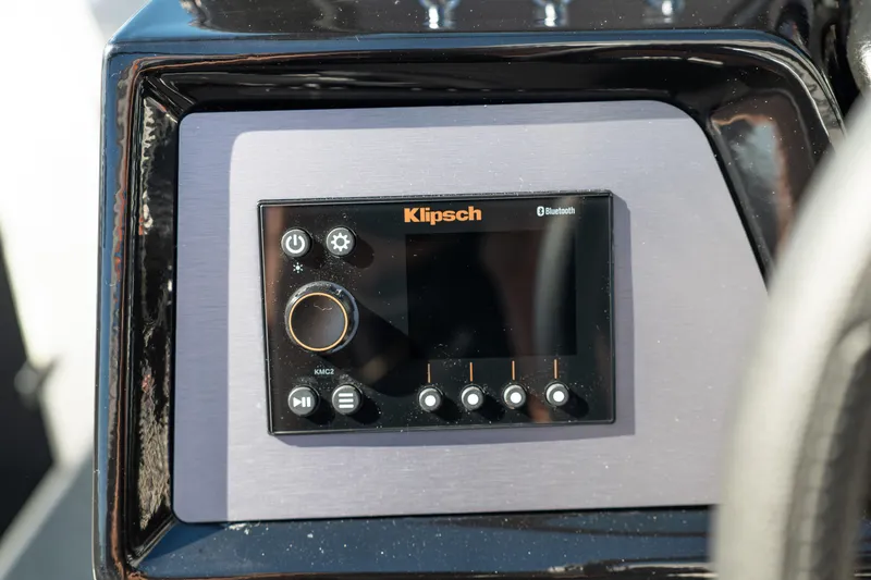 Slide: The Image of 2023 MasterCraft NXT22 boat featuring a Klipsch Bluetooth audio control panel. - 24