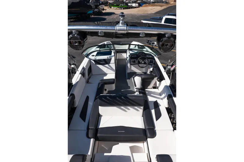 Slide: The Image of 2023 MasterCraft NXT22 boat interior with sleek seating and modern dashboard. - 25