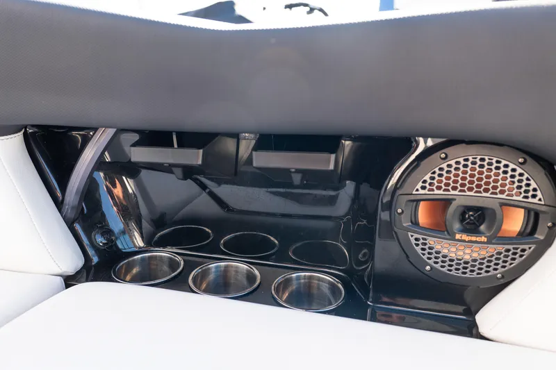 Slide: The Image of 2023 MasterCraft NXT22 interior with Klipsch speaker and cup holders. - 29