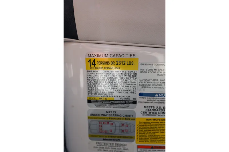 Slide: The Image of 2023 MasterCraft NXT22 capacity label, maximum 14 persons or 2312 lbs. - 9
