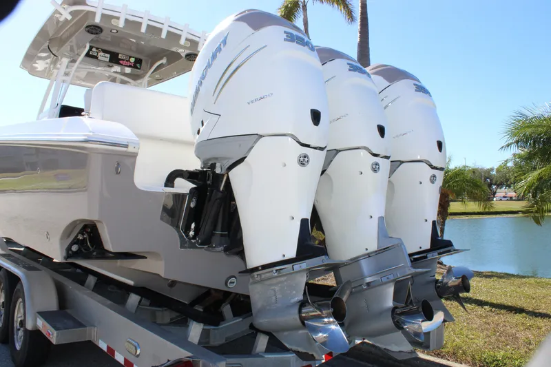 Slide: The Image of 2018 Fountain 38 CC Tournament Edition boat with triple Mercury outboard engines. - 18