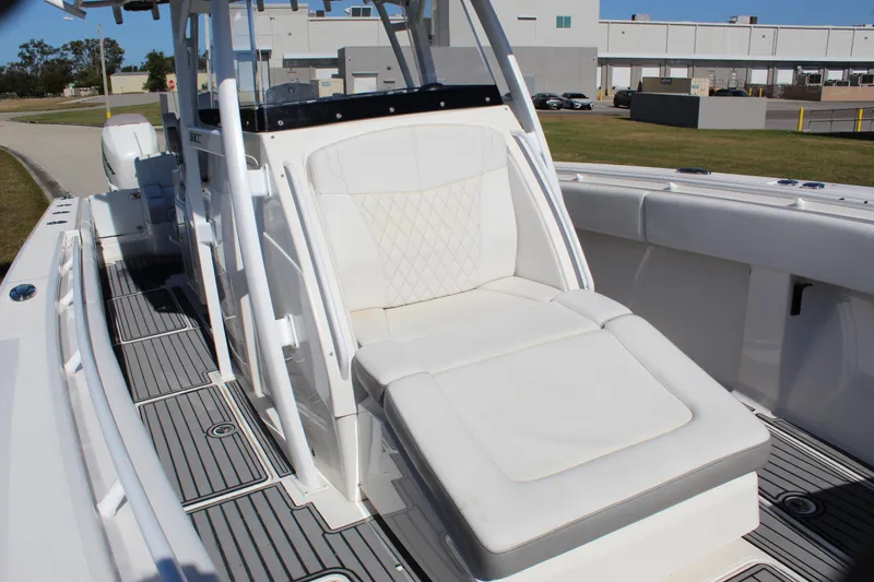 Slide: The Image of 2019 Fountain 38 CC Tournament Edition boat with white seating and sleek design. - 43