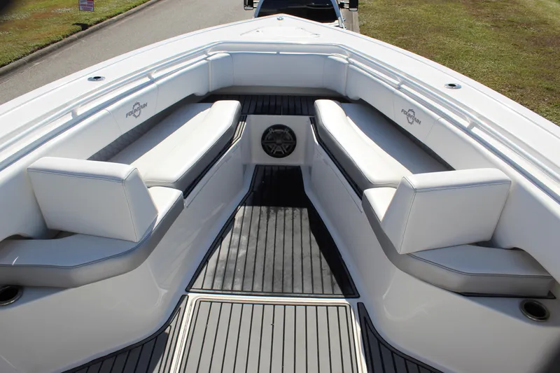 Slide: The Image of 2019 Fountain 38 CC Tournament Edition boat interior with white seating and gray flooring. - 44