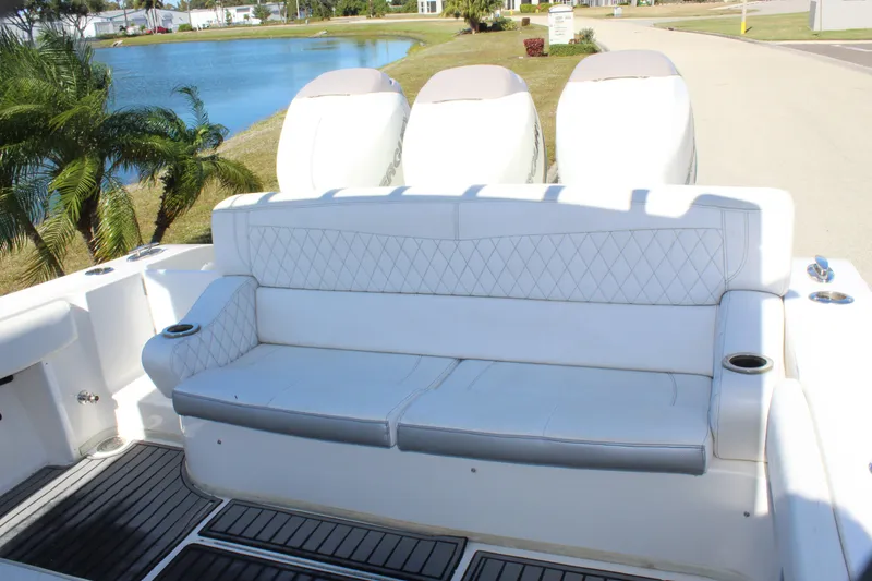 Slide: The Image of 2019 Fountain 38 CC Tournament Edition boat with white seating and triple engines. - 45