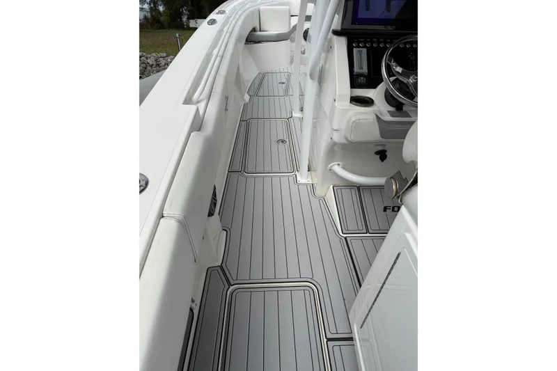 Slide: The Image of 2019 Fountain 38 CC Tournament Edition boat interior with sleek, modern design and advanced controls. - 50