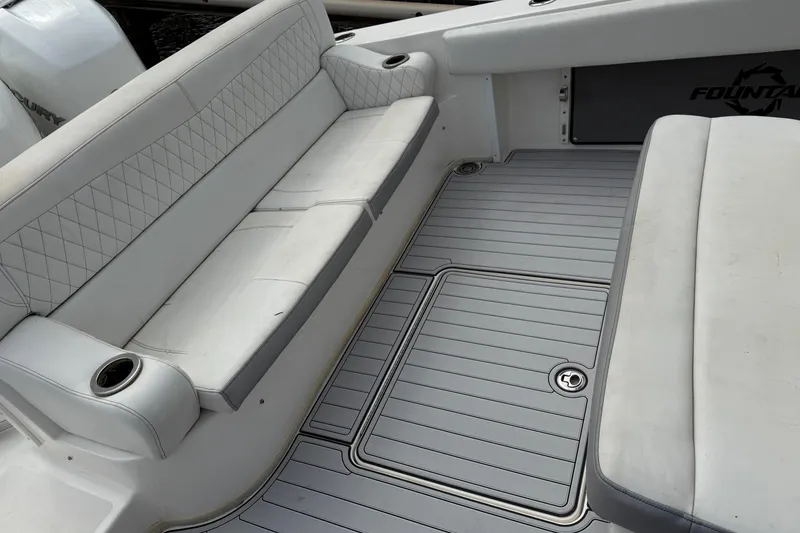 Slide: The Image of 2019 Fountain 38 CC Tournament Edition boat interior with cushioned seating and deck. - 55
