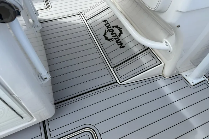 Slide: The Image of 2019 Fountain 38 CC Tournament Edition boat deck with sleek, modern design and logo. - 56
