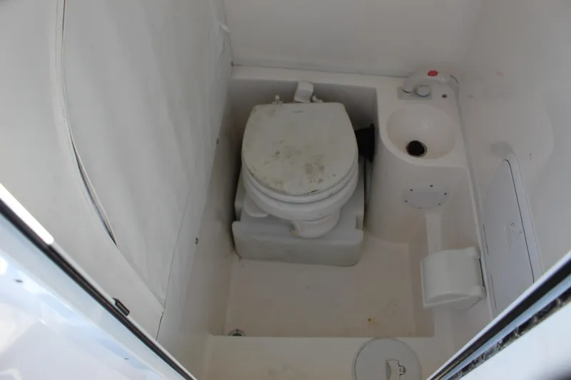 Slide: The Image of 2019 Fountain 38 CC Tournament Edition boat bathroom interior with toilet and sink. - 57