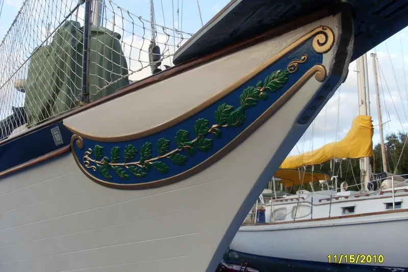 Slide: The Image of Decorative bow of a 1977 Ericson 36 C sailboat with intricate leaf design. - 25