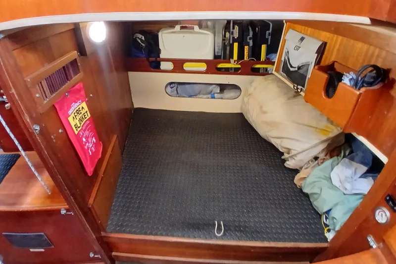 Slide: The Image of Cozy cabin interior of a 1977 Ericson 36 C sailboat with emergency gear. - 37