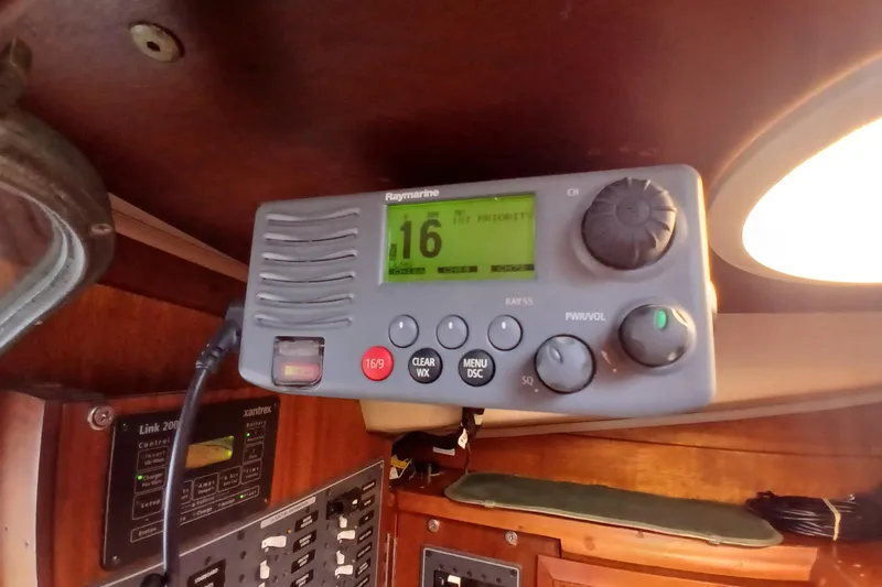 Slide: The Image of VHF radio on 1977 Ericson 36 C sailboat, featuring Raymarine Ray55 marine communication system. - 42