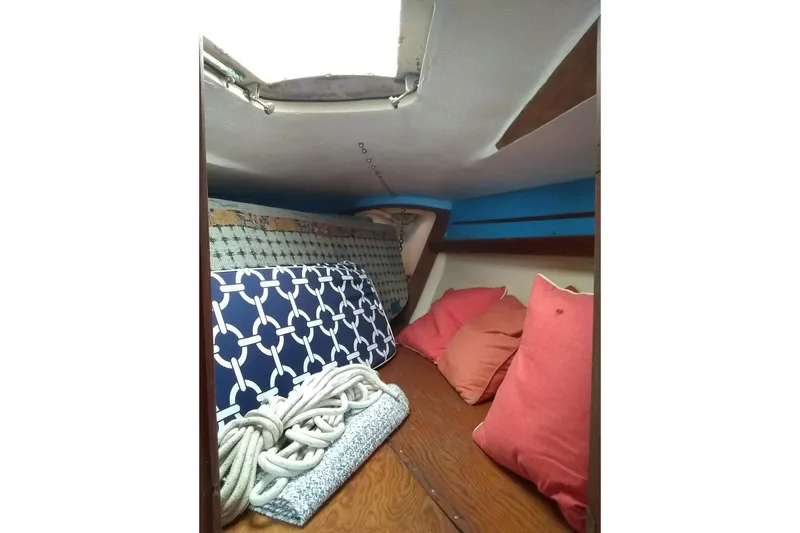 Slide: The Image of Cozy cabin interior of 1975 WDS Santana boat with cushions and nautical decor. - 15