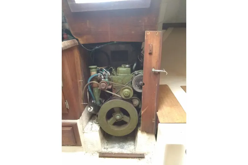 Slide: The Image of 1975 WDS Santana engine inside wooden compartment, showcasing vintage mechanical design. - 17