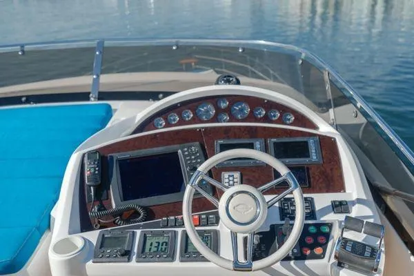 Slide: The Image of Cockpit of 2010 Sunseeker Manhattan 60 yacht with advanced navigation controls. - 10