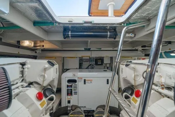 Slide: The Image of Engine room of 2010 Sunseeker Manhattan 60 yacht, featuring dual engines and equipment. - 12