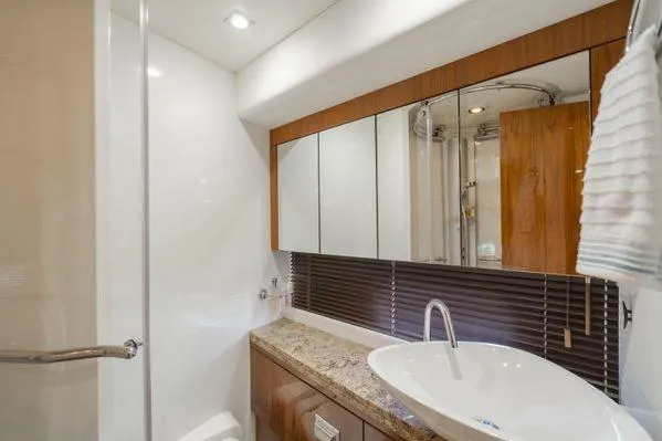 Slide: The Image of Luxurious bathroom in 2010 Sunseeker Manhattan 60 yacht with modern fixtures and elegant design. - 14