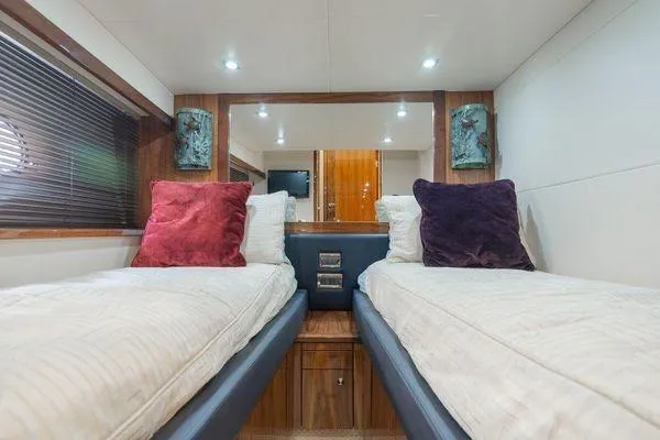 Slide: The Image of Luxurious twin cabin in 2010 Sunseeker Manhattan 60 yacht with plush bedding. - 16