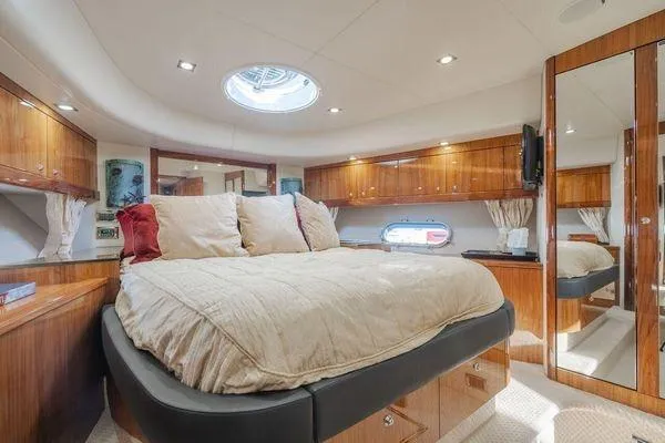 Slide: The Image of Luxurious bedroom interior of 2010 Sunseeker Manhattan 60 yacht with elegant wood finishes. - 18