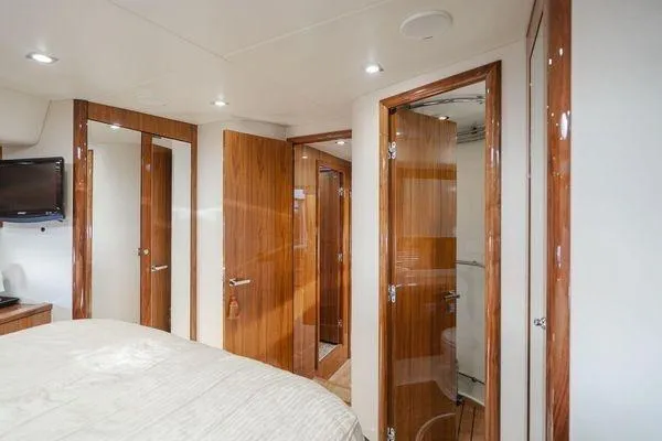 Slide: The Image of Luxurious interior of 2010 Sunseeker Manhattan 60 yacht with wooden doors and modern amenities. - 19