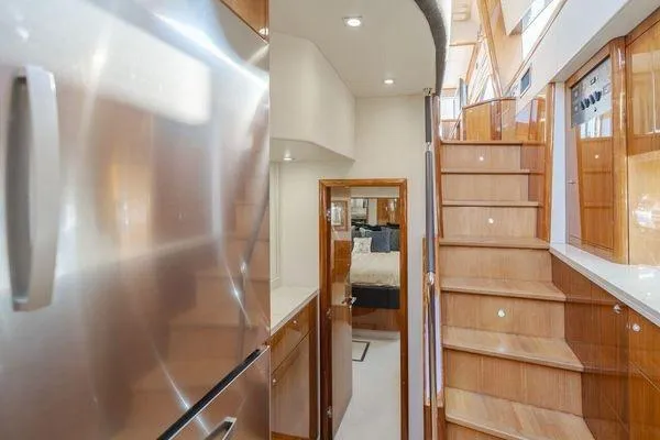 Slide: The Image of Luxurious interior of 2010 Sunseeker Manhattan 60 yacht with wooden stairs and modern design. - 21