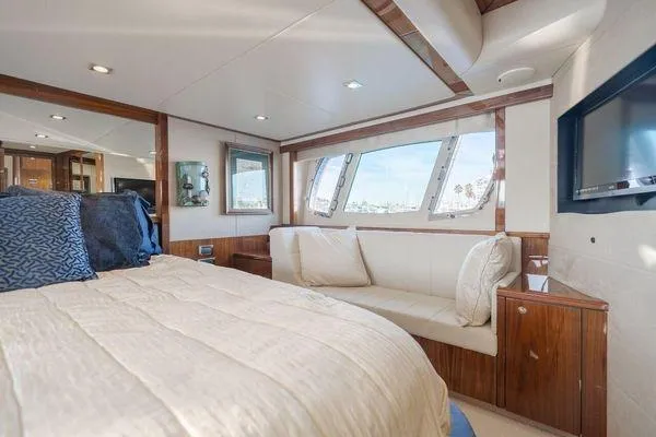 Slide: The Image of Luxurious Sunseeker Manhattan 60 yacht bedroom interior, 2010 model, featuring elegant wood finishes. - 25