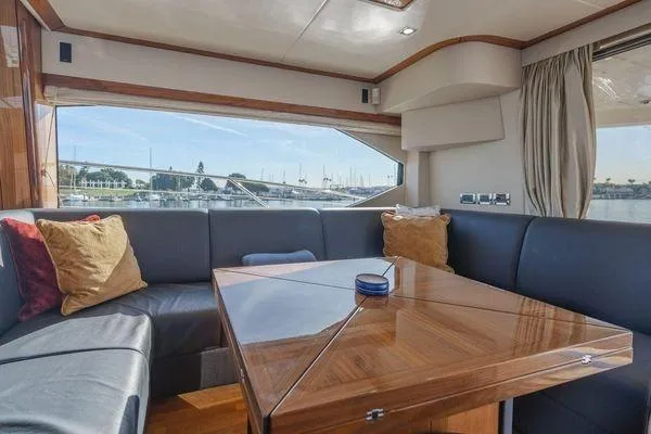 Slide: The Image of Luxurious interior of 2010 Sunseeker Manhattan 60 yacht with elegant seating and wooden table. - 29