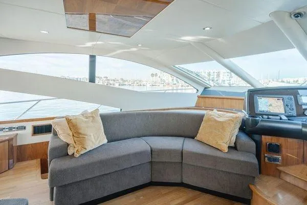 Slide: The Image of Luxurious Sunseeker Manhattan 60 yacht interior with plush seating, panoramic windows, and navigation equipment. - 35
