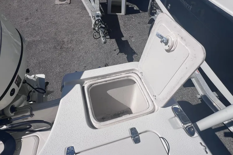 Slide: The Image of Open storage compartment on a 2020 Sea Chaser 21 Sea Skiff boat. - 13