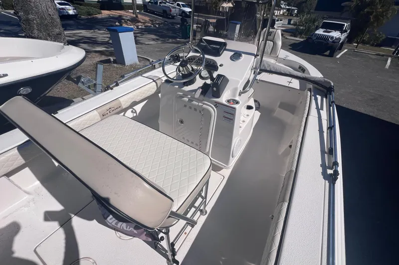 Slide: The Image of 2020 Sea Chaser 21 Sea Skiff boat interior with steering console and seating. - 14