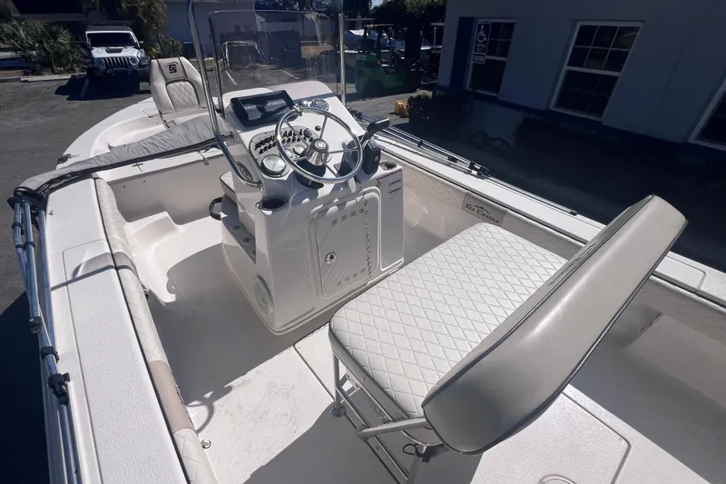 Slide: The Image of 2020 Sea Chaser 21 Sea Skiff boat interior with steering console and seating. - 15