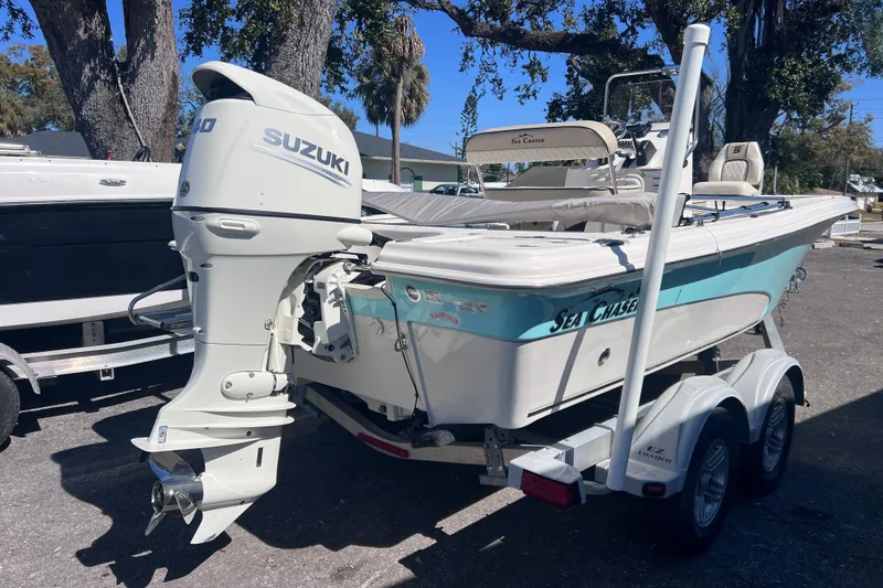 Slide: The Image of 2020 Sea Chaser 21 Sea Skiff boat with Suzuki outboard motor on trailer. - 2
