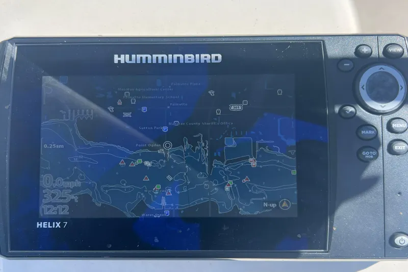 Slide: The Image of Humminbird Helix 7 GPS on 2020 Sea Chaser 21 Sea Skiff displaying nautical map. - 21