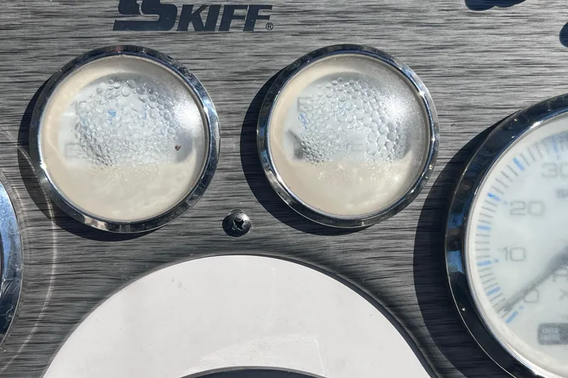 Slide: The Image of Dashboard of 2020 Sea Chaser 21 Sea Skiff with condensation on gauges. - 23