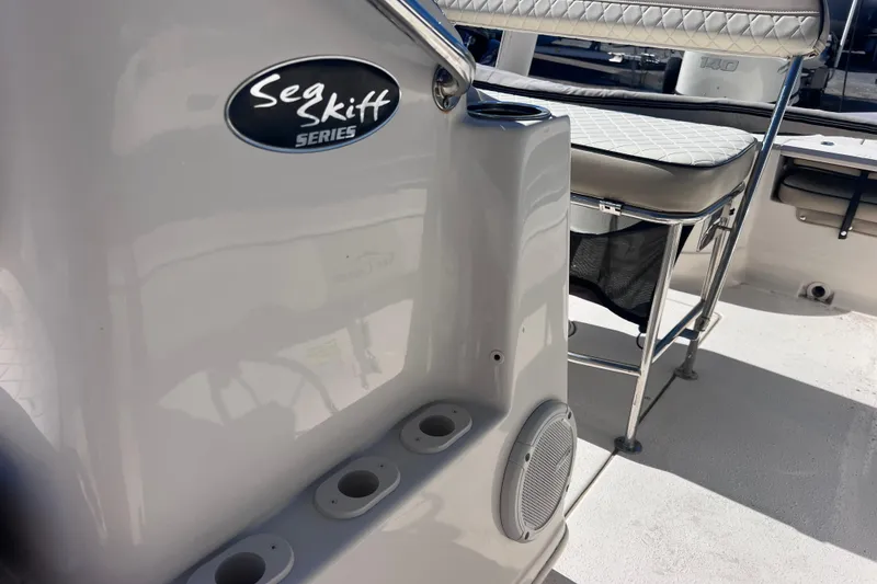 Slide: The Image of 2020 Sea Chaser 21 Sea Skiff boat interior with seating and logo detail. - 26