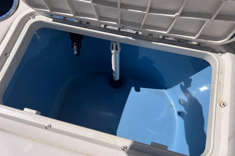 Slide: The Image of Open livewell compartment in 2020 Sea Chaser 21 Sea Skiff boat. - 28