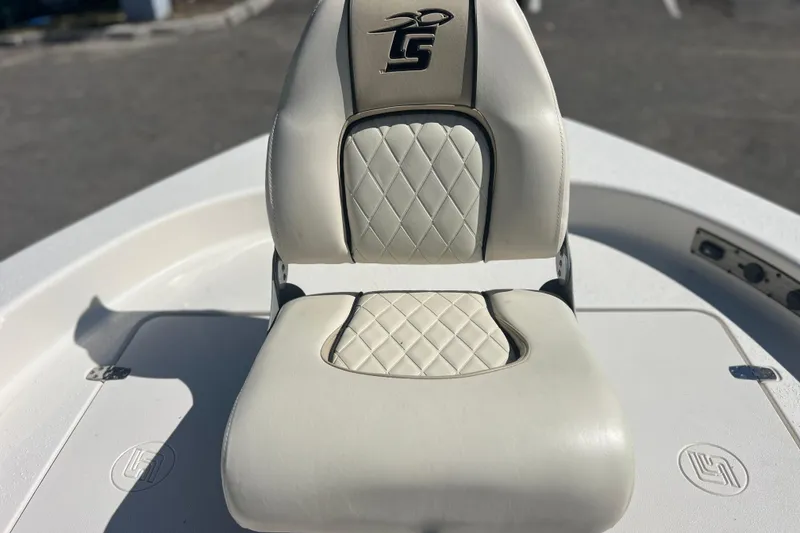 Slide: The Image of 2020 Sea Chaser 21 Sea Skiff boat seat with diamond-patterned upholstery. - 29