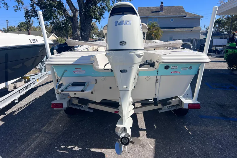 Slide: The Image of 2020 Sea Chaser 21 Sea Skiff boat with outboard motor, parked on a trailer. - 3